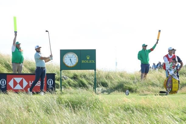 Tyrrell Hatton of England plays his shot from the 11th tee during Day One of The 149th Open at Royal St George’s Golf Club on July 15, 2021 in...