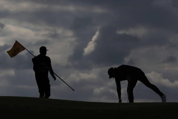 Tommy Fleetwood of England collects his ball on the 10th green during Day One of The 149th Open at Royal St George’s Golf Club on July 15, 2021 in...