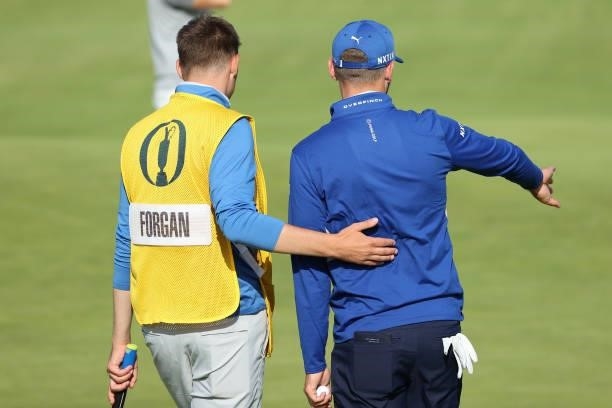 Sam Forgan of England and caddie react on the 18th green during Day One of The 149th Open at Royal St George’s Golf Club on July 15, 2021 in...
