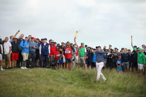 Justin Thomas of United States plays out of the rough on the 12th hole during Day One of The 149th Open at Royal St George’s Golf Club on July 15,...