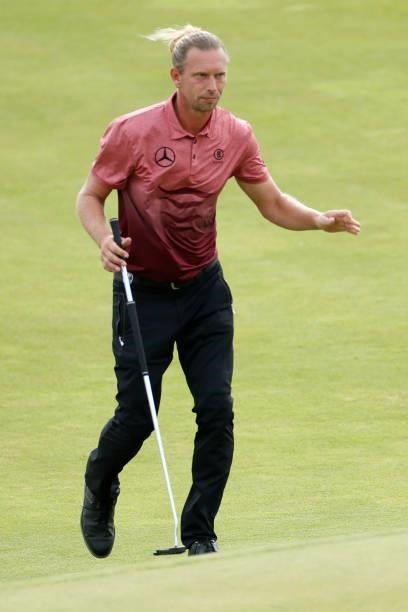 Marcel Siem of Germany waves on the 15th green during Day One of The 149th Open at Royal St George’s Golf Club on July 15, 2021 in Sandwich, England.
