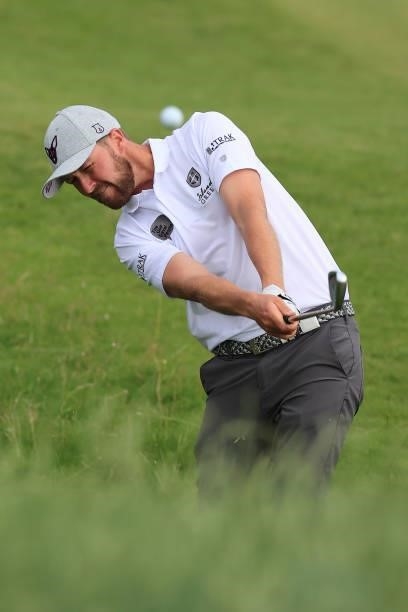 Nicholas Poppleton of England plays his second shot on the 9th hole during Day One of The 149th Open at Royal St George’s Golf Club on July 15, 2021...