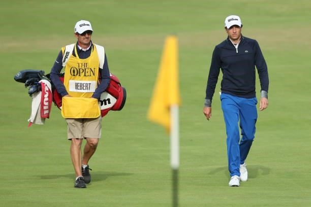 Benjamin Herbert of France and caddie walk on the 18th hole during Day One of The 149th Open at Royal St George’s Golf Club on July 15, 2021 in...