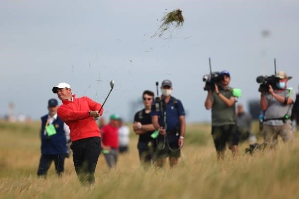 Rory McIlroy of Northern Ireland plays his second shot on the 12th hole during Day One of The 149th Open at Royal St George’s Golf Club on July 15,...