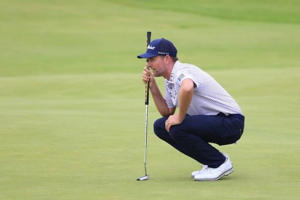 Webb Simpson of the United States lines up a putt on the 18th green during Day One of The 149th Open at Royal St George’s Golf Club on July 15, 2021...