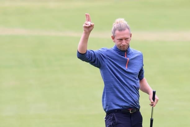 Marcel Siem of Germany reacts after making birdie on the 18th green during Day One of The 149th Open at Royal St George’s Golf Club on July 15, 2021...