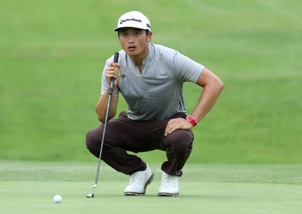 Bobby Bai of China lines up a putt on the 16th green during the first round of the Barbasol Championship at Keene Trace Golf Club on July 15, 2021 in...