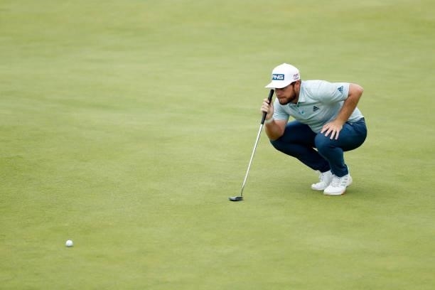 Tyrrell Hatton of England lines up a putt on the 18th green during Day One of The 149th Open at Royal St George’s Golf Club on July 15, 2021 in...