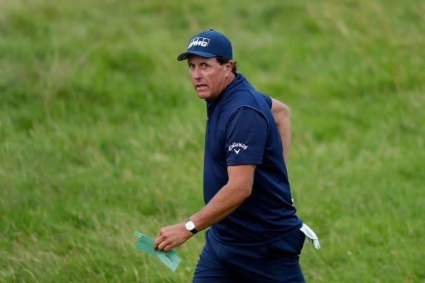 Phil Mickelson of the United States looks on as he walks off the 18th green during Day One of The 149th Open at Royal St George’s Golf Club on July...