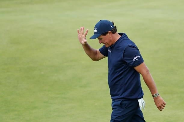 Phil Mickelson of the United States waves as he walks off the 18th green during Day One of The 149th Open at Royal St George’s Golf Club on July 15,...