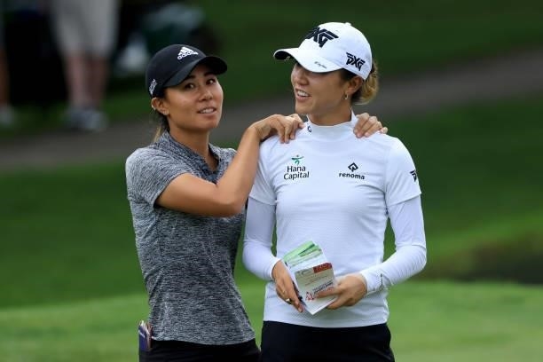 Danielle Kang and Lydia Ko of Australia smile after a birdie on the fifth hole during the second round of the Dow Great Lakes Bay Invitational at...