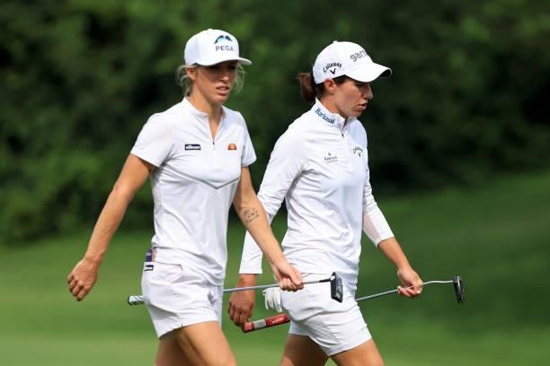 Carlota Ciganda of Spain and Mel Reid of England walk down the 15th hole during the second round of the Dow Great Lakes Bay Invitational at Midland...