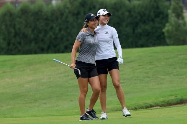 Danielle Kang and Lydia Ko of Australia celebrate an eagle on the 11th hole during the second round of the Dow Great Lakes Bay Invitational at...