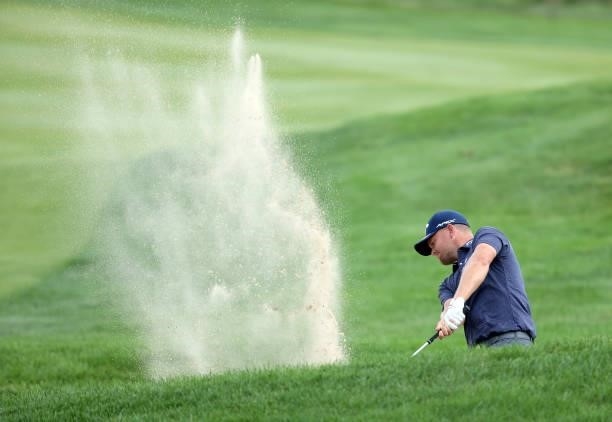 Tom Lewis of England plays his second shot on the 18th hole during the first round of the Barbasol Championship at Keene Trace Golf Club on July 15,...