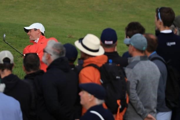 Rory McIlroy of Northern Ireland plays a shot as spectators watch on during Day One of The 149th Open at Royal St George’s Golf Club on July 15, 2021...