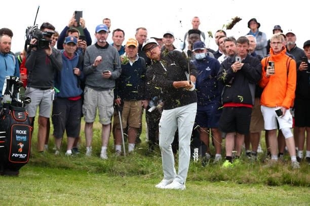 Rickie Fowler of USA plays his second shot from the rough on the 17th during Day One of The 149th Open at Royal St George’s Golf Club on July 15,...