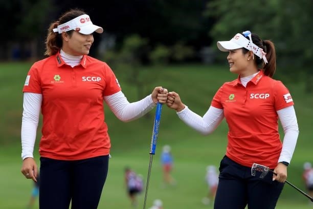 Ariya Jutanugarn of Thailand celebrates a birdie on the 15th hole with her sister and teammate Moriya Jutanugarn during the second round of the Dow...