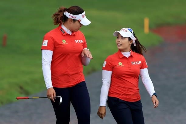 Ariya Jutanugarn of Thailand walks with her sister and teammate Moriya Jutanugarn during the second round of the Dow Great Lakes Bay Invitational at...