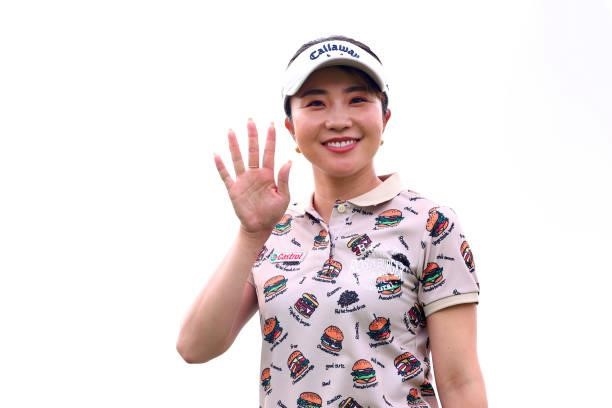 Riko Inoue of Japan waves on the 10th hole during first round of the GMO Internet Ladies Samantha Thavasa Global Cup at Eagle Point Golf Club on July...