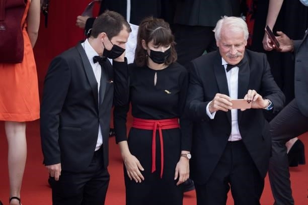 Photographer and director Yann Arthus-Bertrand is reminded not to take photographs as he attends the "France