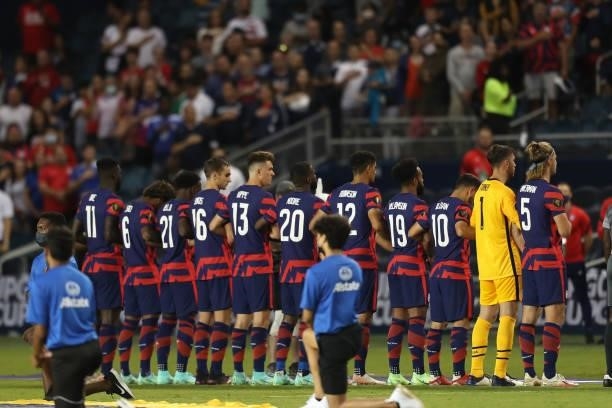 United States players stand for their national anthem before the Group B match between Martinique and United States as part of the 2021 CONCACAF Gold...