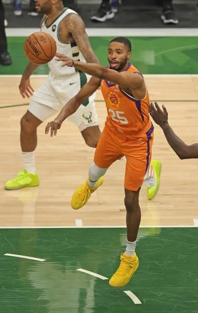 Mikal Bridges of the Phoenix Suns passes against the Milwaukee Bucks at Fiserv Forum on July 14, 2021 in Milwaukee, Wisconsin. The Bucks defeated the...