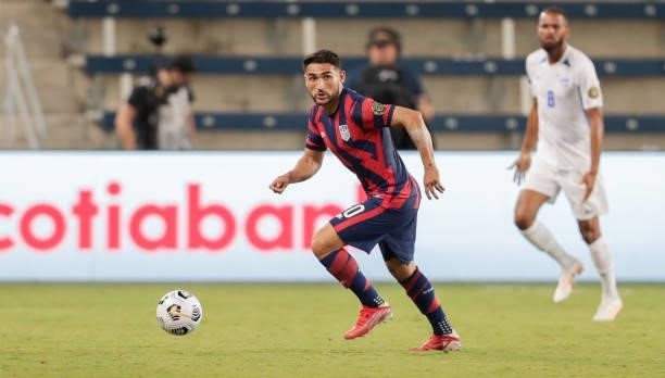 Cristian Roldan of the United States moves with the ball during a game between Martinique and USMNT at Children's Mercy Park on July 15, 2021 in...