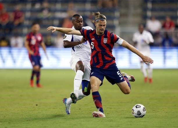 Walker Zimmerman of the United States controls the ball as Kevin Fortune of Martinique defends during the 2021 CONCACAF Gold Cup match at Children's...