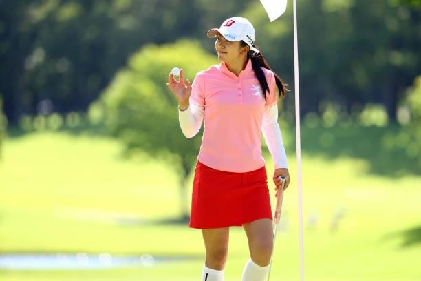 Kotone Hori of Japan acknowledges fans after holing out with the birdie on the 18th green during first round of the GMO Internet Ladies Samantha...