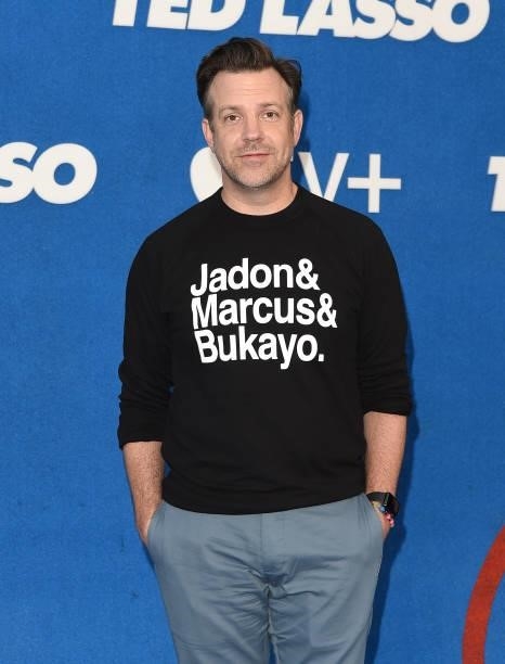 Jason Sudeikis wears a top featuring the names of England football players Jadon Sancho, Marcus Rashford and Bukayo Saka as he attends Apple's "Ted...