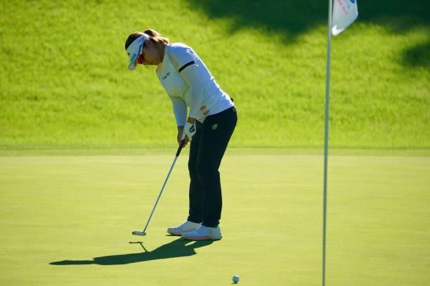 Eri Okayama of Japan attempts a putt on the 17th green during first round of the GMO Internet Ladies Samantha Thavasa Global Cup at Eagle Point Golf...