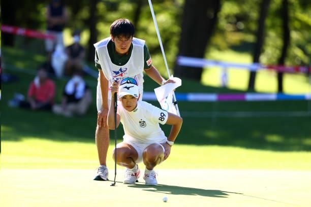 Erika Hara of Japan lines up a putt on the 18th green during first round of the GMO Internet Ladies Samantha Thavasa Global Cup at Eagle Point Golf...