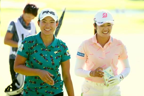 Hinako Shibuno and Mone Inami of Japan react after holing out on the 18th green during first round of the GMO Internet Ladies Samantha Thavasa Global...