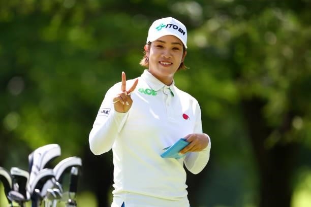 Mayu Hamada of Japan poses after holing out with the birdie on the 9th green during first round of the GMO Internet Ladies Samantha Thavasa Global...