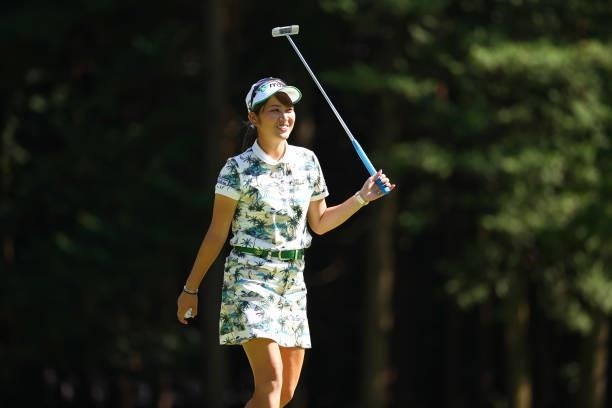 Hikari Tanabe of Japan smiles after holing out with the birdie on the 9th green during first round of the GMO Internet Ladies Samantha Thavasa Global...