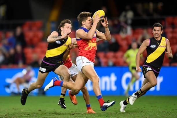 Zac Bailey of the Lions intercepts the ball before kicking a goal during the round 18 AFL match between the Richmond Tigers and the Brisbane Lions at...