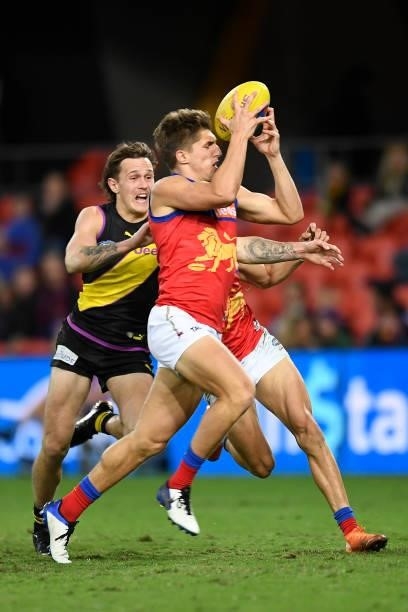 Zac Bailey of the Lions intercepts the ball before kicking a goal during the round 18 AFL match between the Richmond Tigers and the Brisbane Lions at...