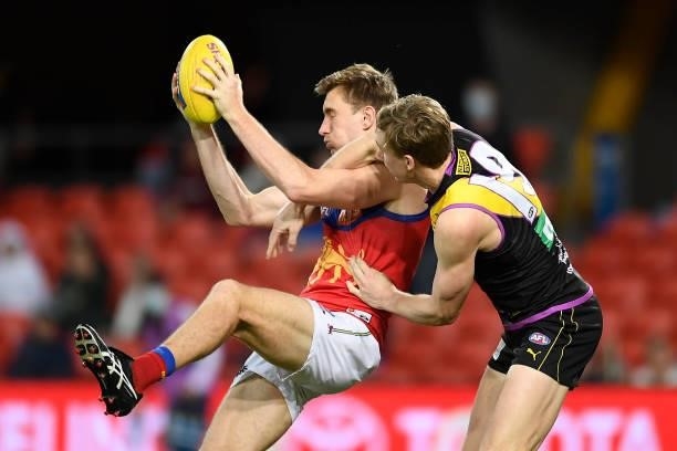 Harris Andrews of the Lions wins the ball against Tom Lynch of the Tigers during the round 18 AFL match between the Richmond Tigers and the Brisbane...