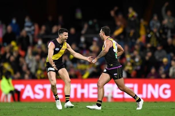 Jack Graham of the Tigers celebrates kicking a goal during the round 18 AFL match between the Richmond Tigers and the Brisbane Lions at Metricon...