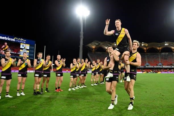 Jack Riewoldt of the Tigers is chaired off the field after his 300th match during the round 18 AFL match between the Richmond Tigers and the Brisbane...