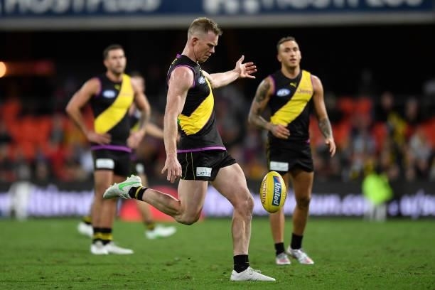 Jack Riewoldt of the Tigers kicks a goal during the round 18 AFL match between the Richmond Tigers and the Brisbane Lions at Metricon Stadium on July...