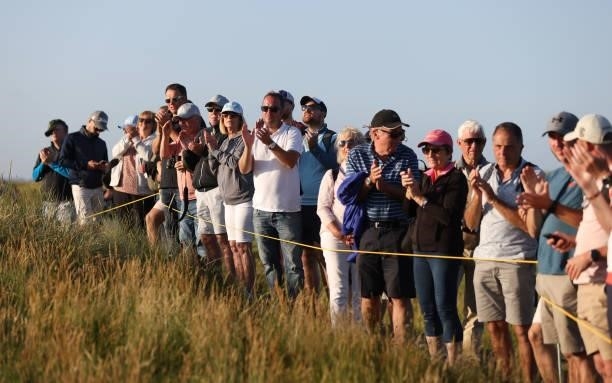 Spectators applaud during Day Two of The 149th Open at Royal St George’s Golf Club on July 16, 2021 in Sandwich, England.