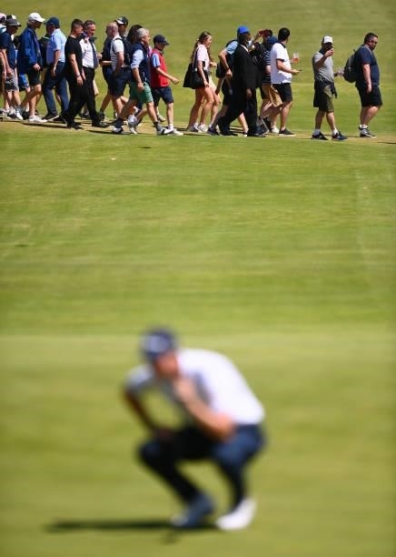 Spectators cross the 18th hole during Day Two of The 149th Open at Royal St George’s Golf Club on July 16, 2021 in Sandwich, England.