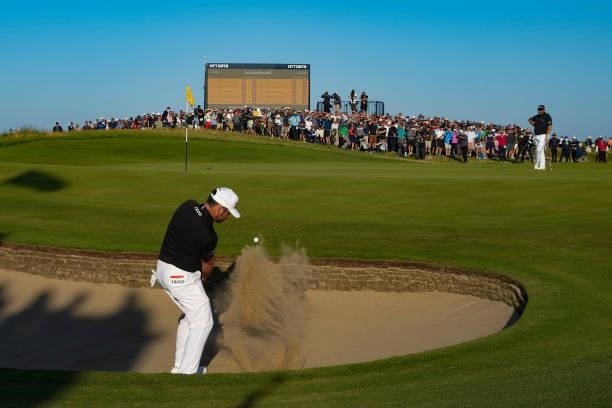 Louis Oosthuizen of South Africa plays out of a bunker on the 16th during Day Two of The 149th Open at Royal St George’s Golf Club on July 16, 2021...