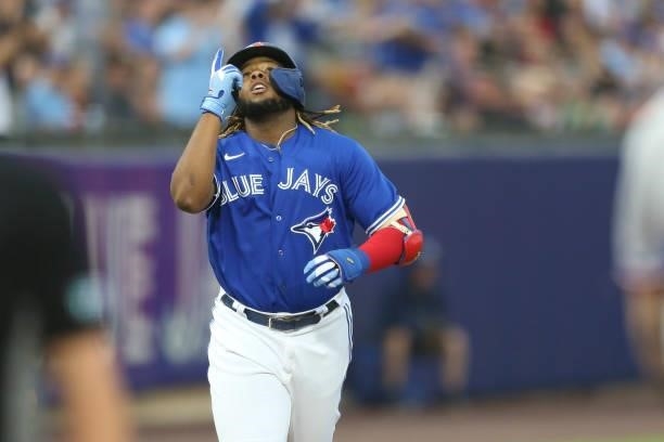 Vladimir Guerrero Jr. #27 of the Toronto Blue Jays celebrates after hitting a home run during the first inning against the Texas Rangers at Sahlen...