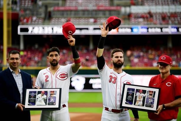 Nick Castellanos and Jesse Winker of the Cincinnati Reds are honored with plaques for their All-Star game appearance prior to their game against the...