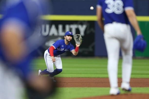 Bo Bichette of the Toronto Blue Jays makes a diving catch to get out Nick Solak of the Texas Rangers during the fifth inning at Sahlen Field on July...