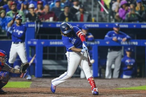 Vladimir Guerrero Jr. #27 of the Toronto Blue Jays hits a three-run home run during the seventh inning against the Texas Rangers at Sahlen Field on...