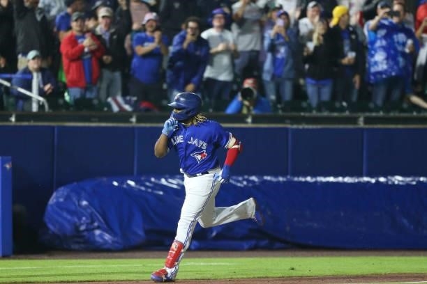 Vladimir Guerrero Jr. #27 of the Toronto Blue Jays celebrates hitting a three-run home run during the sixth inning against the Texas Rangers at...
