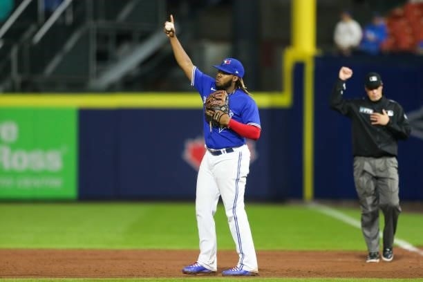 Vladimir Guerrero Jr. #27 of the Toronto Blue Jays reacts after the final out of the game against the Texas Rangers at Sahlen Field on July 16, 2021...